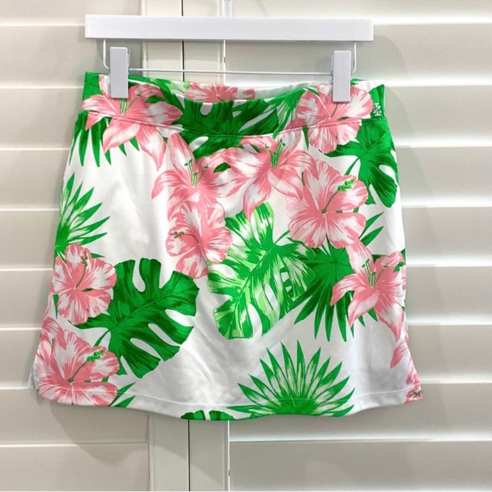 Izod golf or tennis skirt. Pink hibiscus with green and white. Three pockets.